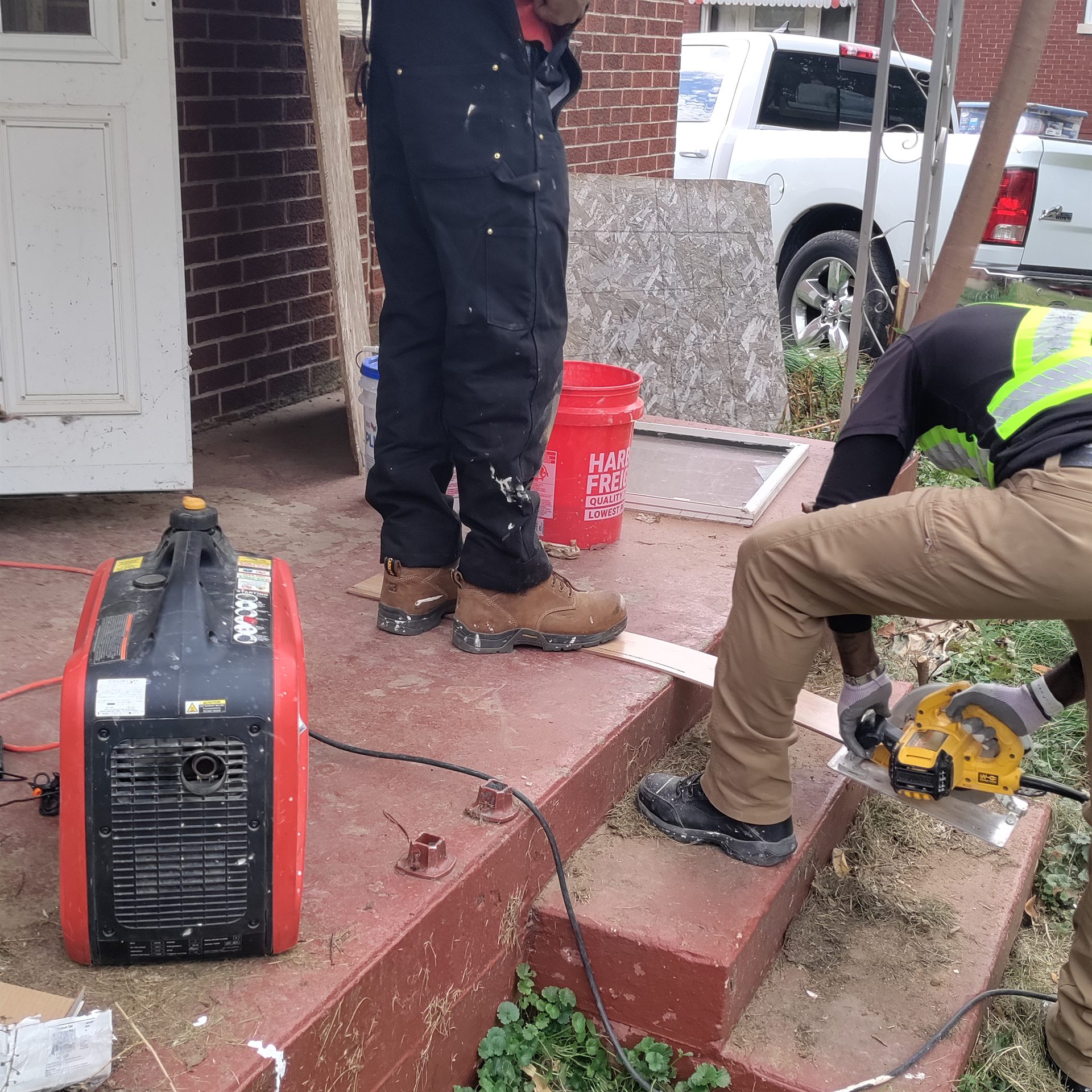 Participants learning side by side during a neighborhood rehabilitation project