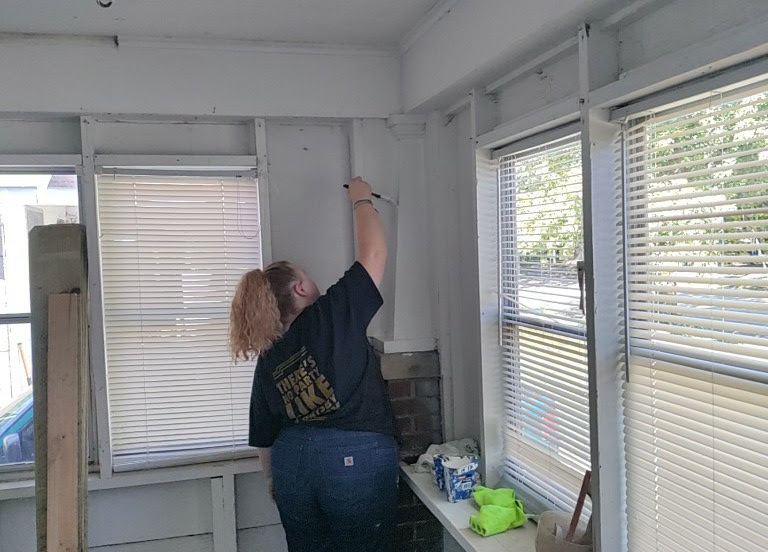 Participant painting during a One Level apprenticeship training session