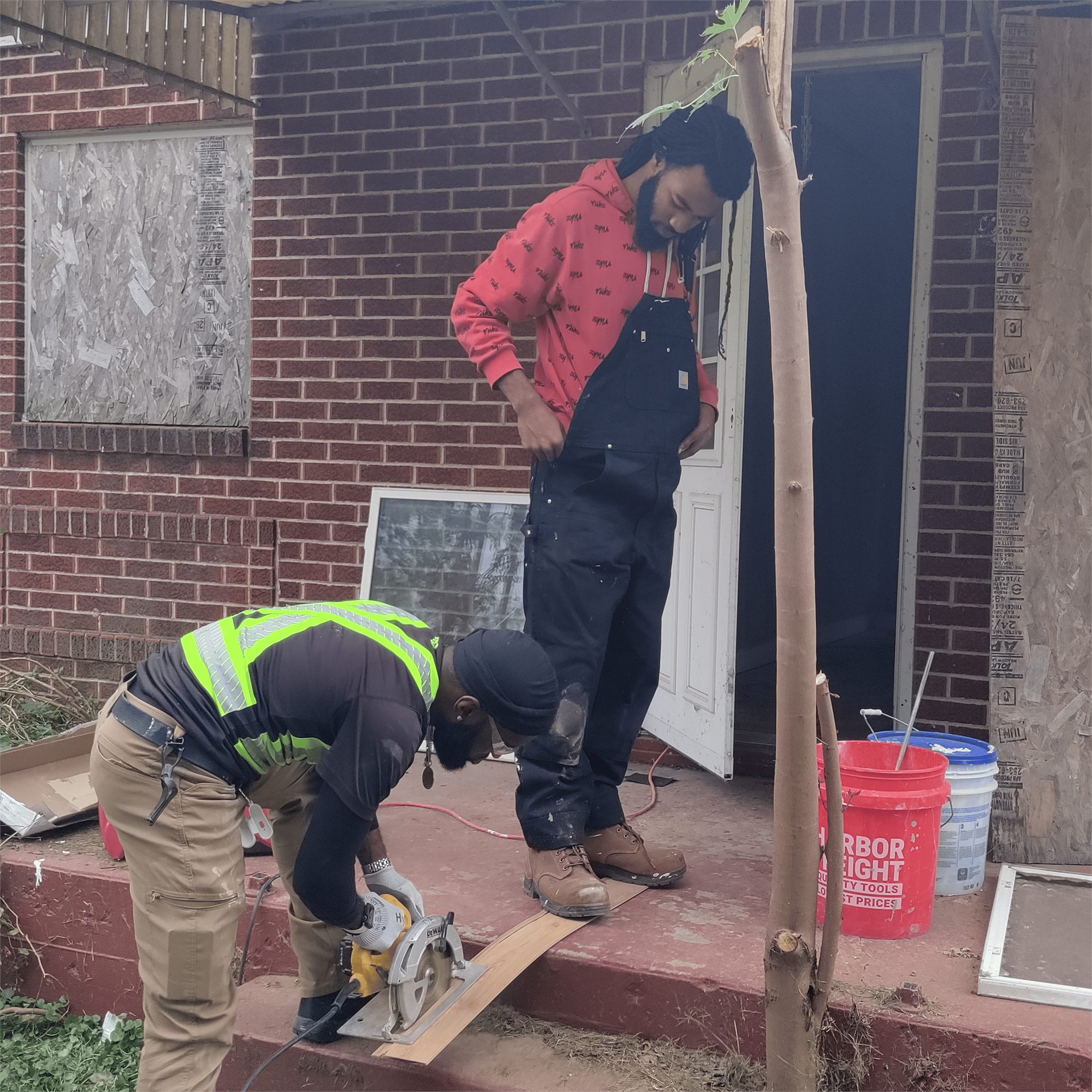 Participants working together during an exterior rehab and repair training moment